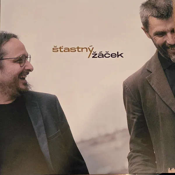 Šťastný/Žáček