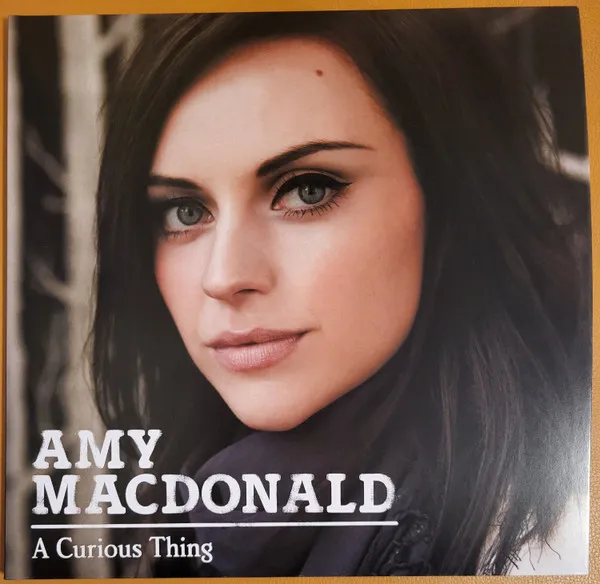 A Curious Thing (15th Anniversary) (Limited Edition) (Pink & Transparent Vinyl) (National Album Day 2025)